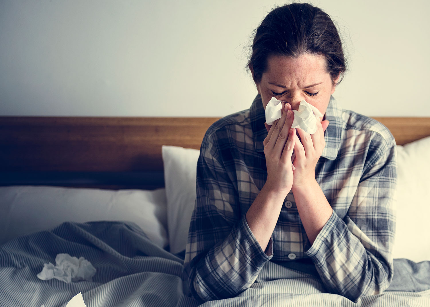 A woman in bed with illness