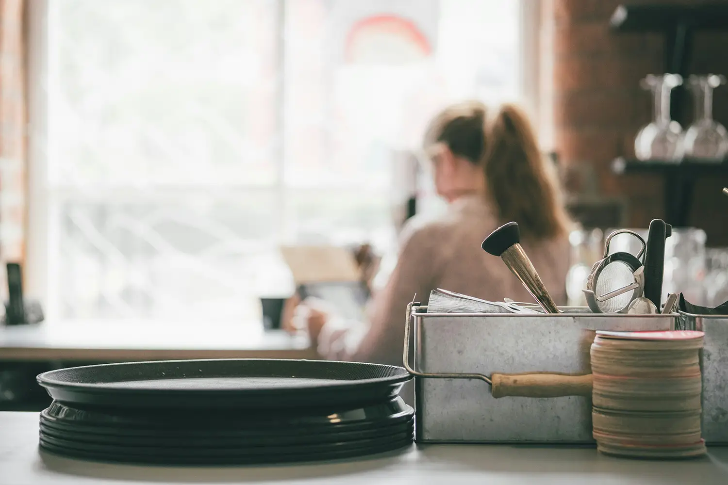 A restaurant owner at a her desk